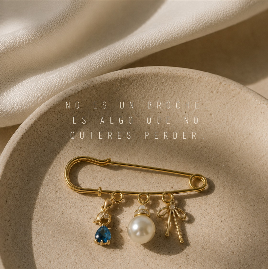 Imperdible Sömi dorado con gota azul, perla y lazo